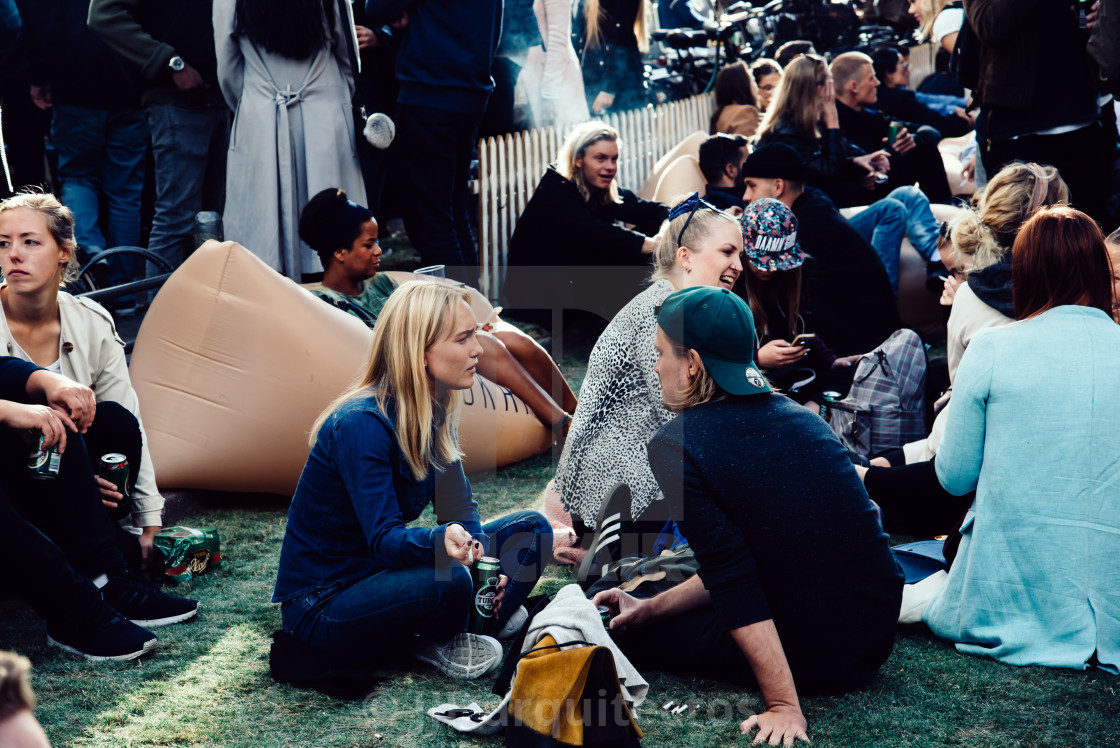 "Crowd of young people sitting and enjoying in Kronprinsensgade," stock image
