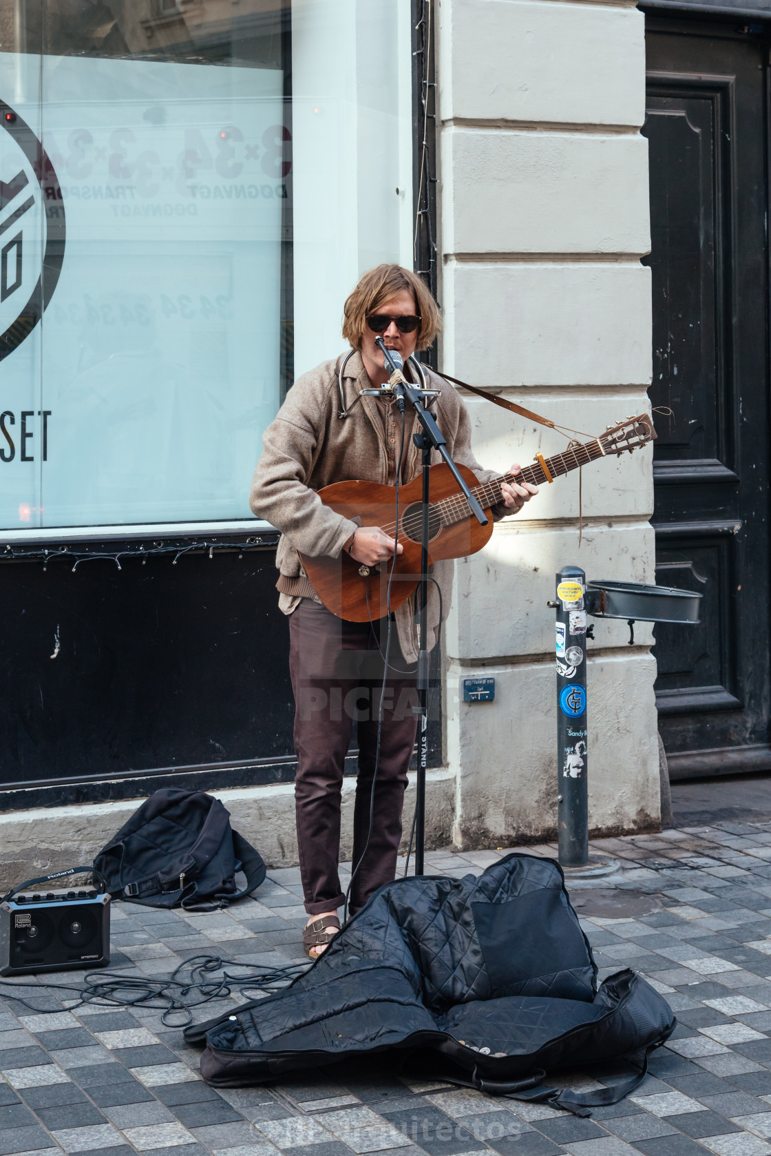 "Busker playing guitar and singing in pedestrian street in Copenh" stock image