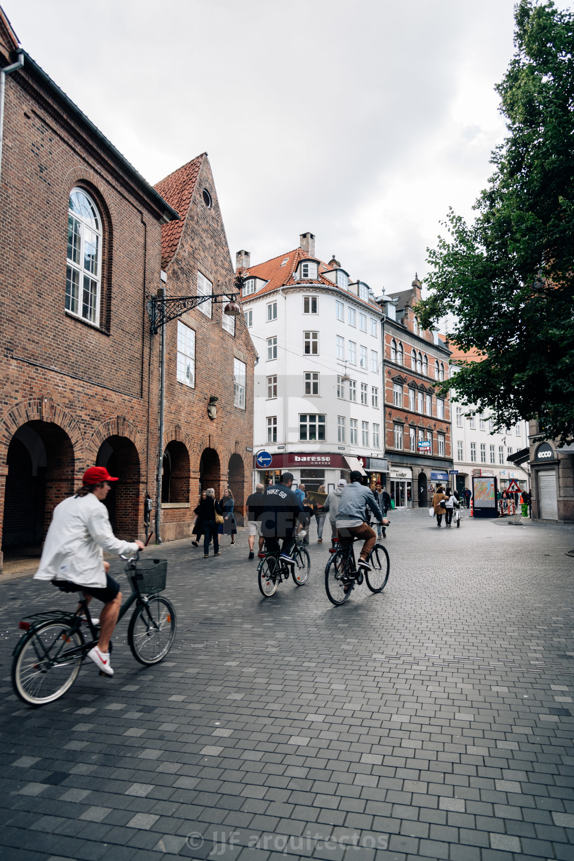 "Cyclists in pedestrian street in central Copenhagen a cloudy day" stock image