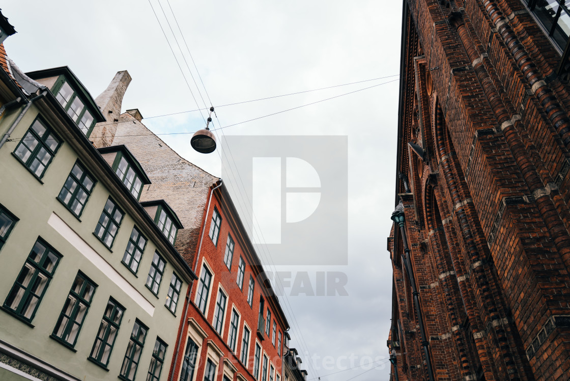 "Low angle view of residential buildings and church in historical" stock image