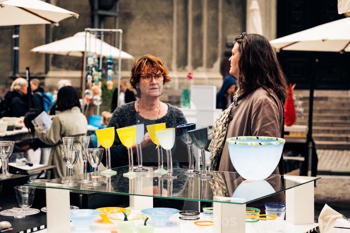 "People in antiques and artisans street market in Frue Square in" stock image