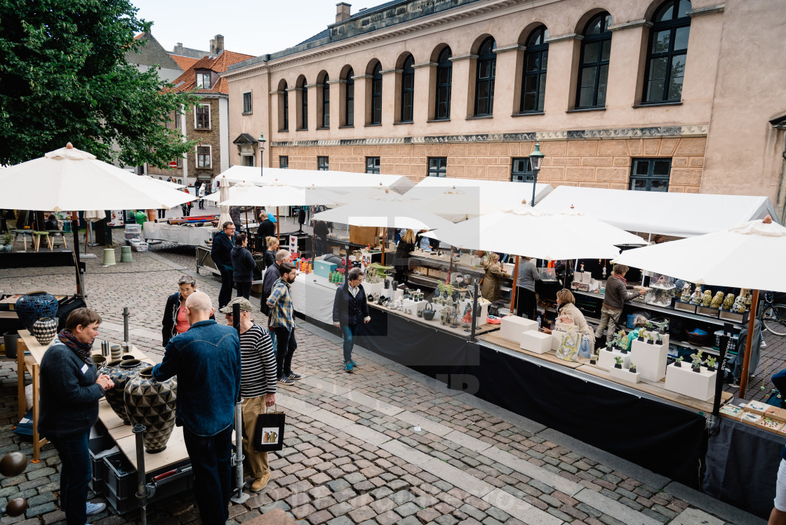 "People in antiques and artisans street market in Frue Square in" stock image