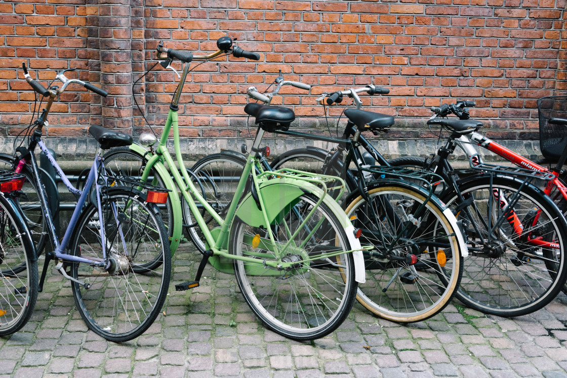 "Bicycles parked in old brick building in Copenhagen" stock image