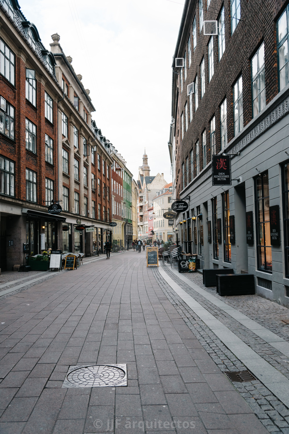 "Commercial street with sidewalk cafe in historical city centre o" stock image