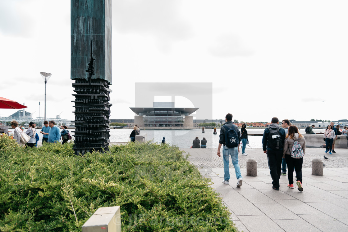 "Tourists in Amaliehaven waterfront with Opera House building on" stock image