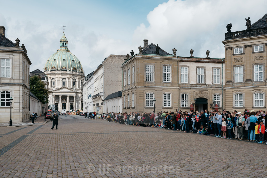 "A crowd of tourists in waiting the changing guard in Amalienborg" stock image