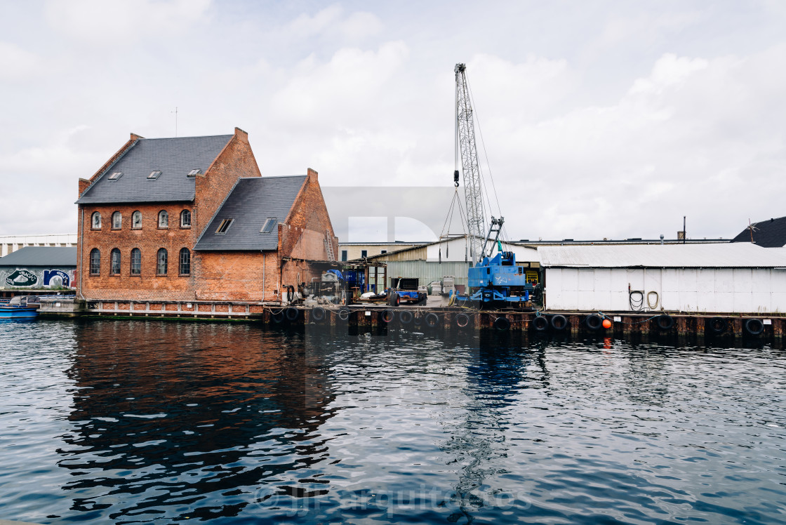 "Port of Copenhagen with blue crane a cloudy summer day" stock image