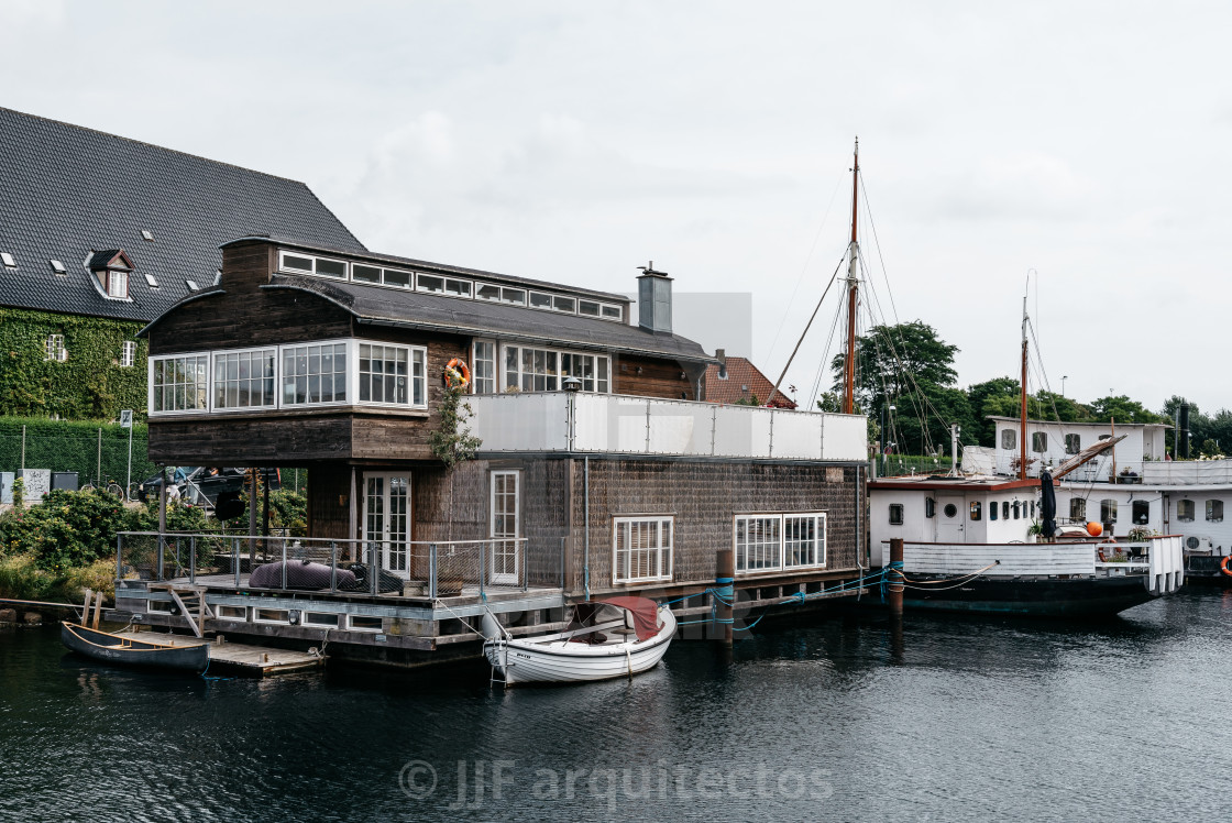 "Picturesque house boat in the port of Copenhagen a cloudy summe" stock image