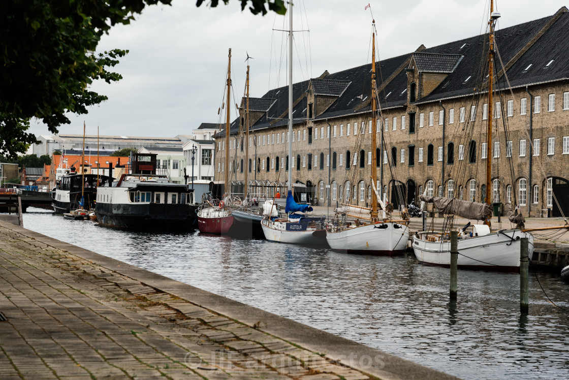 "Port of Copenhagen with old ships a cloudy summer day" stock image