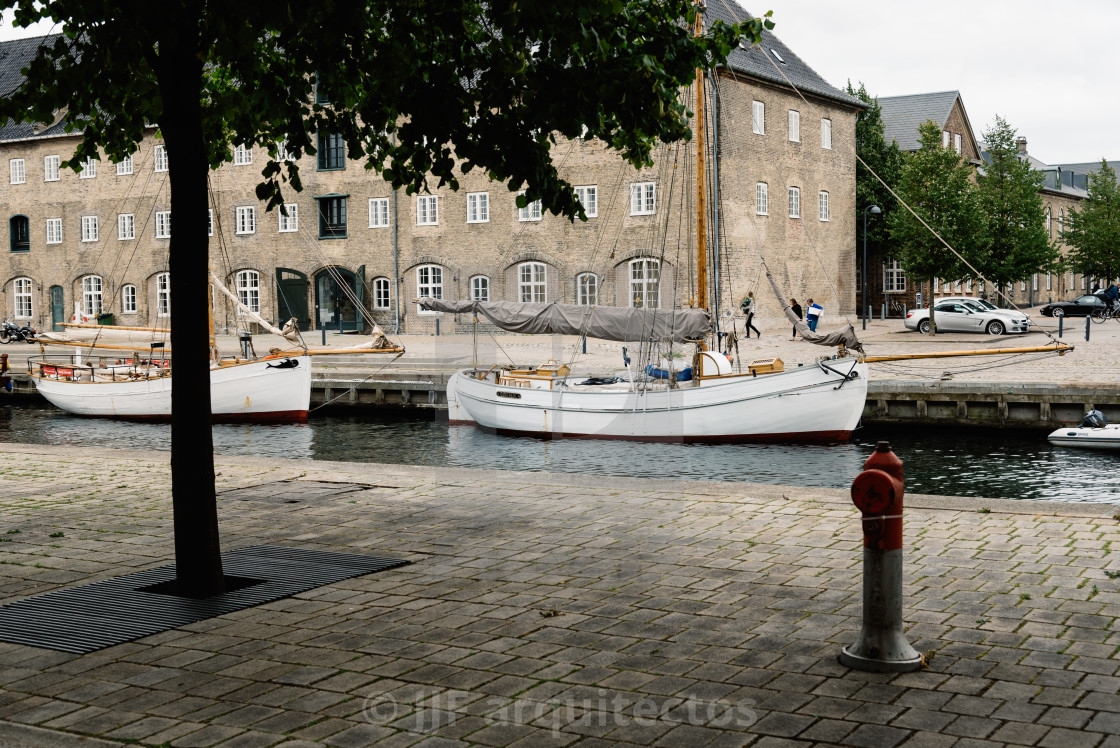 "Port of Copenhagen with old ships a cloudy summer day" stock image