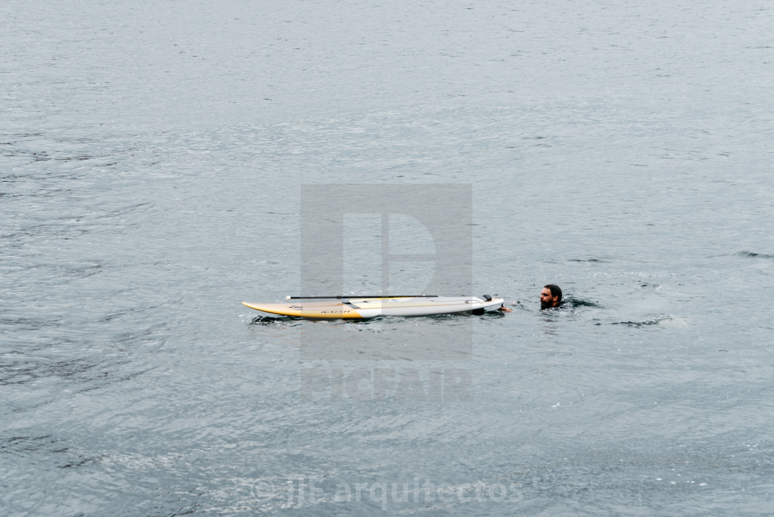 "Surfer in the water with his board in Copenhagen harbor" stock image