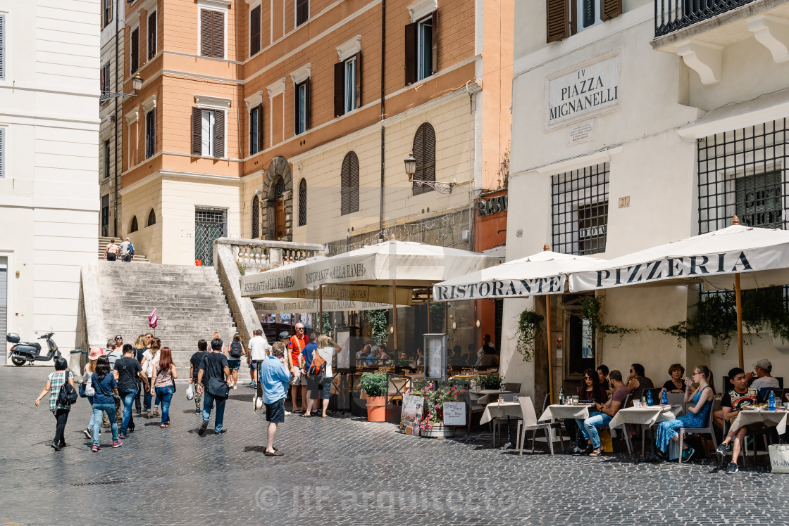 "Sidewalk restaurant with tourists in Roman square a sunny summer" stock image