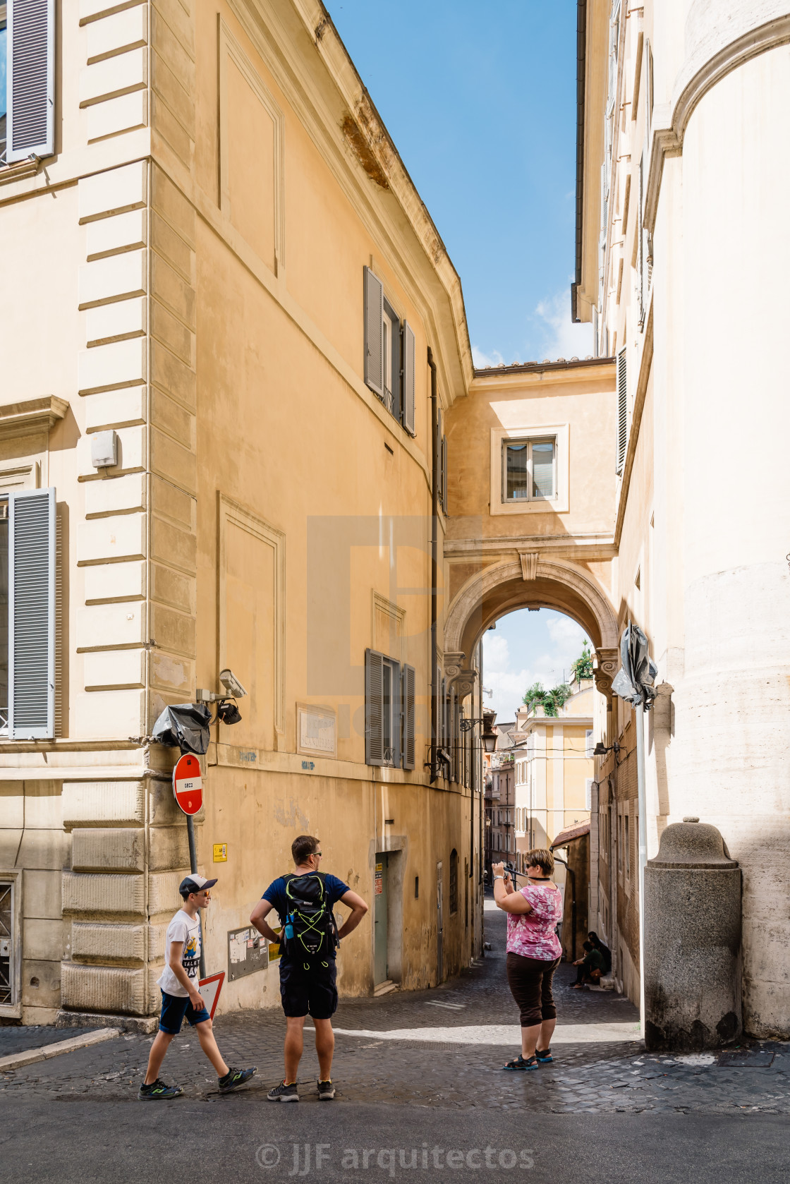 "Tourists in traditional street in the historical centre of Rome." stock image