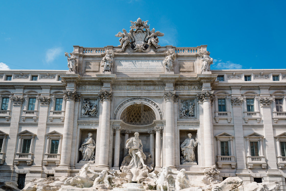 "Trevi fountain in Rome against blue sky a summer sunny day" stock image