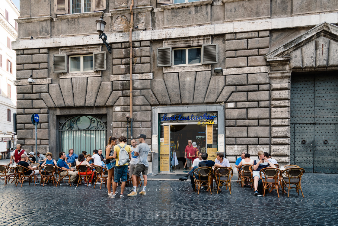 "Sidewalk cafe with tourists in square in Rome a sunny summer day" stock image