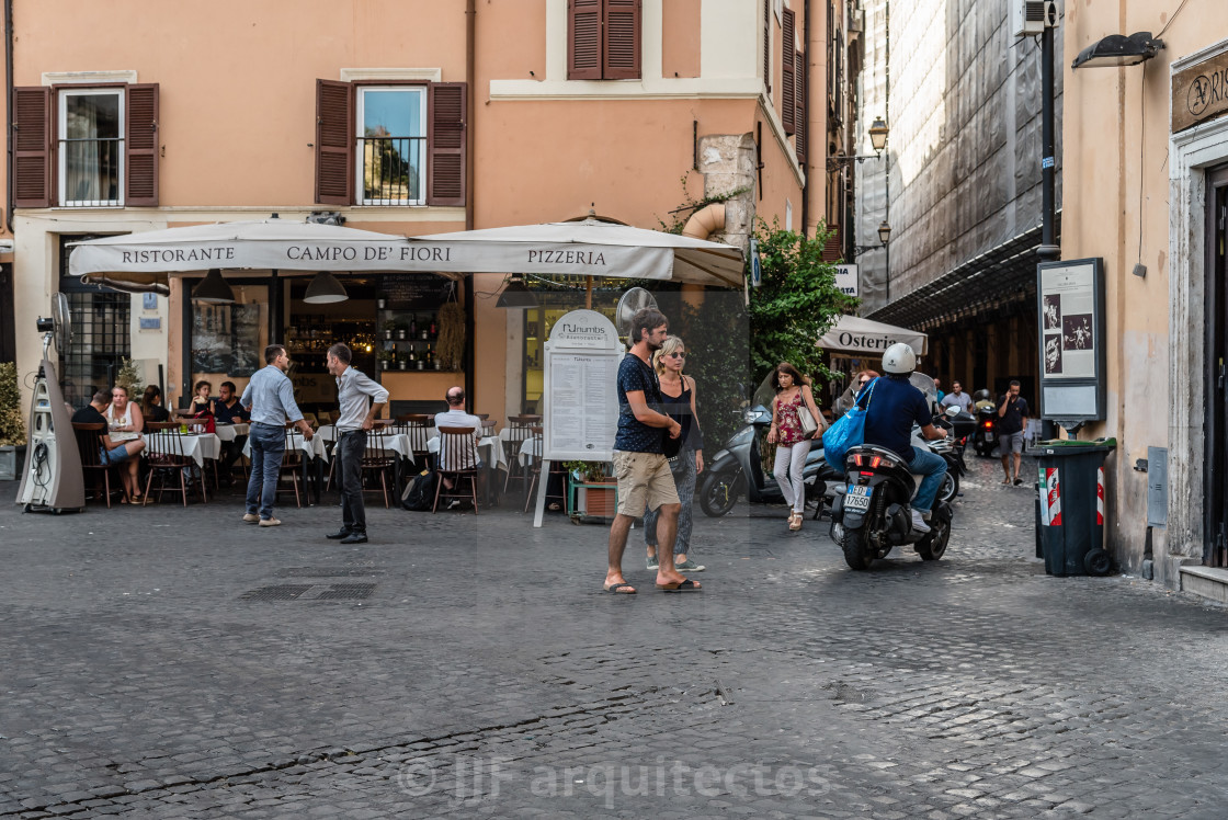 "Sidewalk restaurant with tourists in Campo di Fiori square squar" stock image