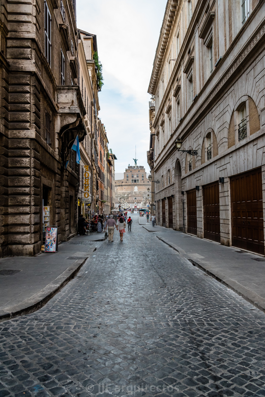 "Tourists in traditional street in the historical centre of Rome." stock image