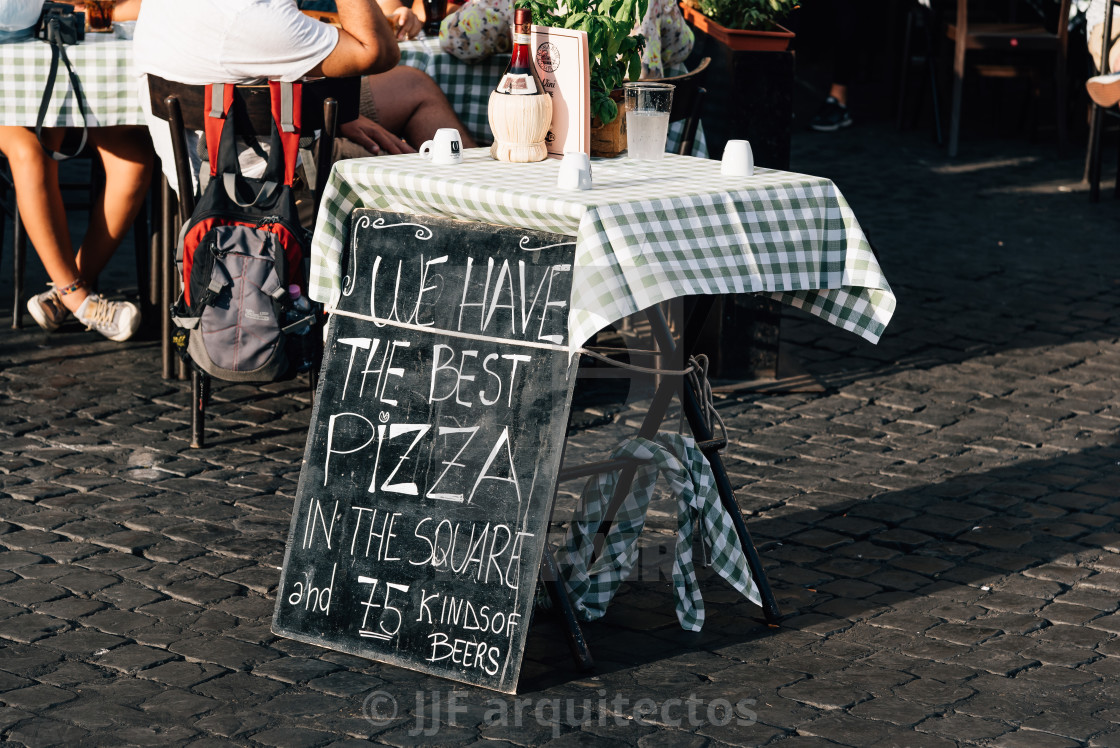 "Sidewalk pizzeria in Rome a sunny summer day." stock image