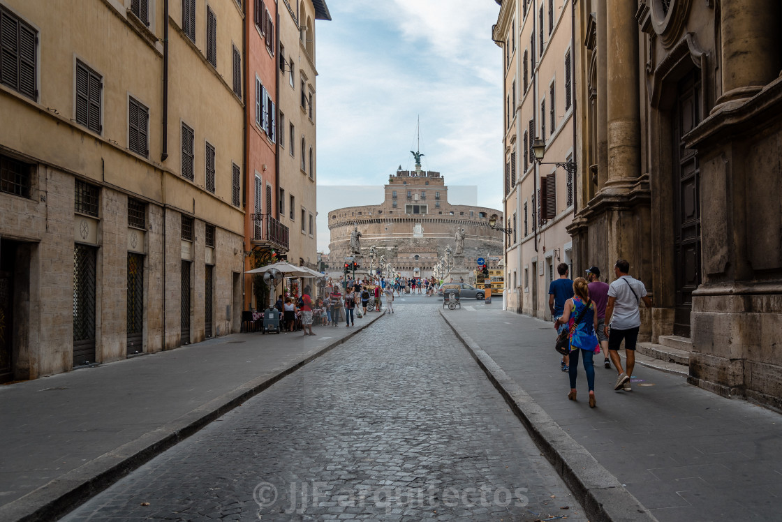 "Tourists in traditional street in the historical centre of Rome." stock image