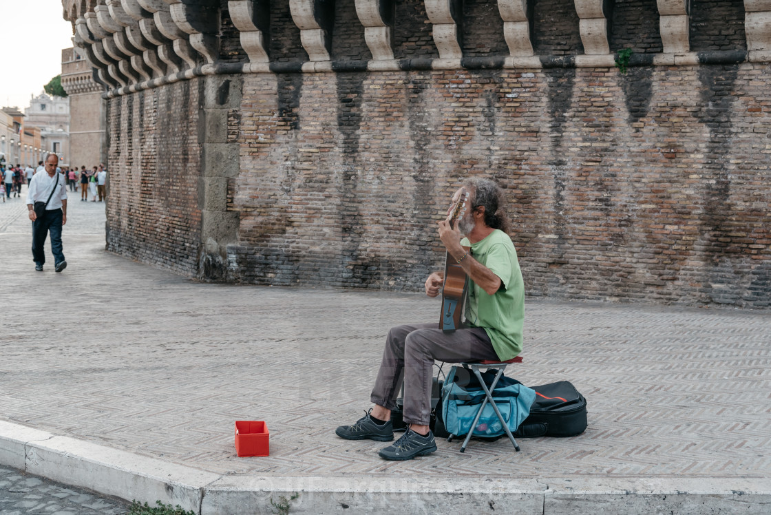"Musician playing guitar in the streets of Rome" stock image