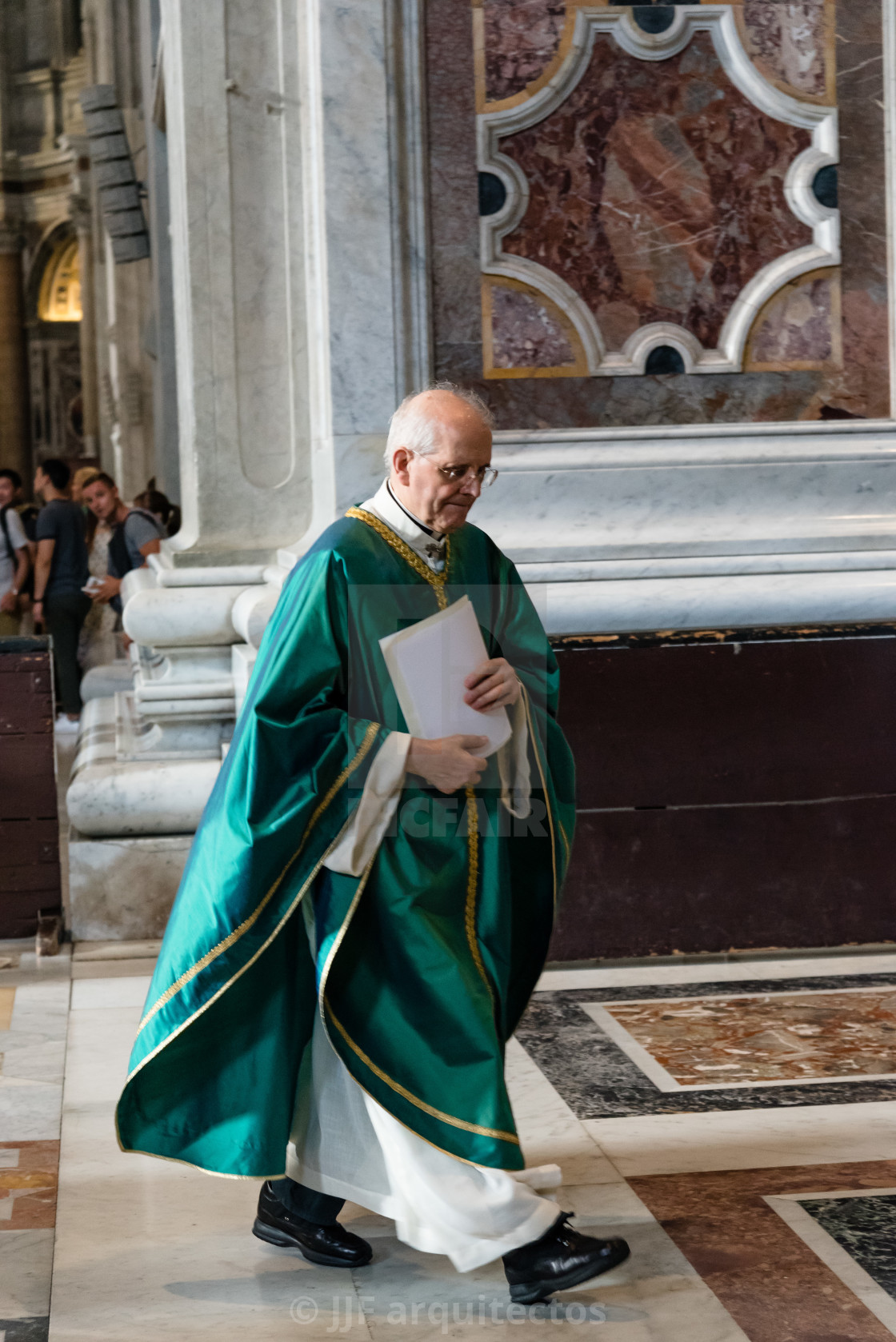 "Priest in the interior of St Peters Basilica" stock image