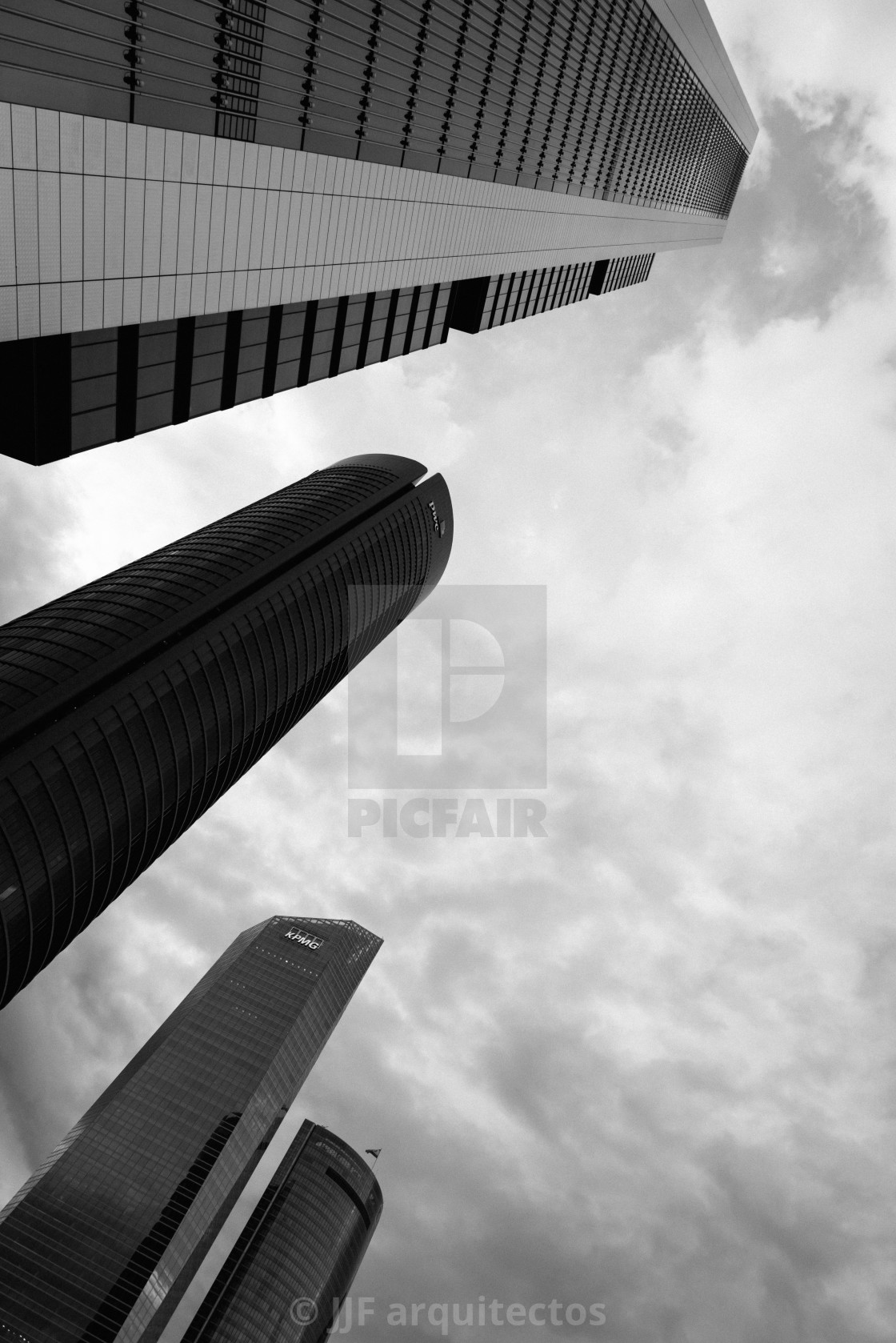 "Low angle view of skyscraper in business district against sky" stock image