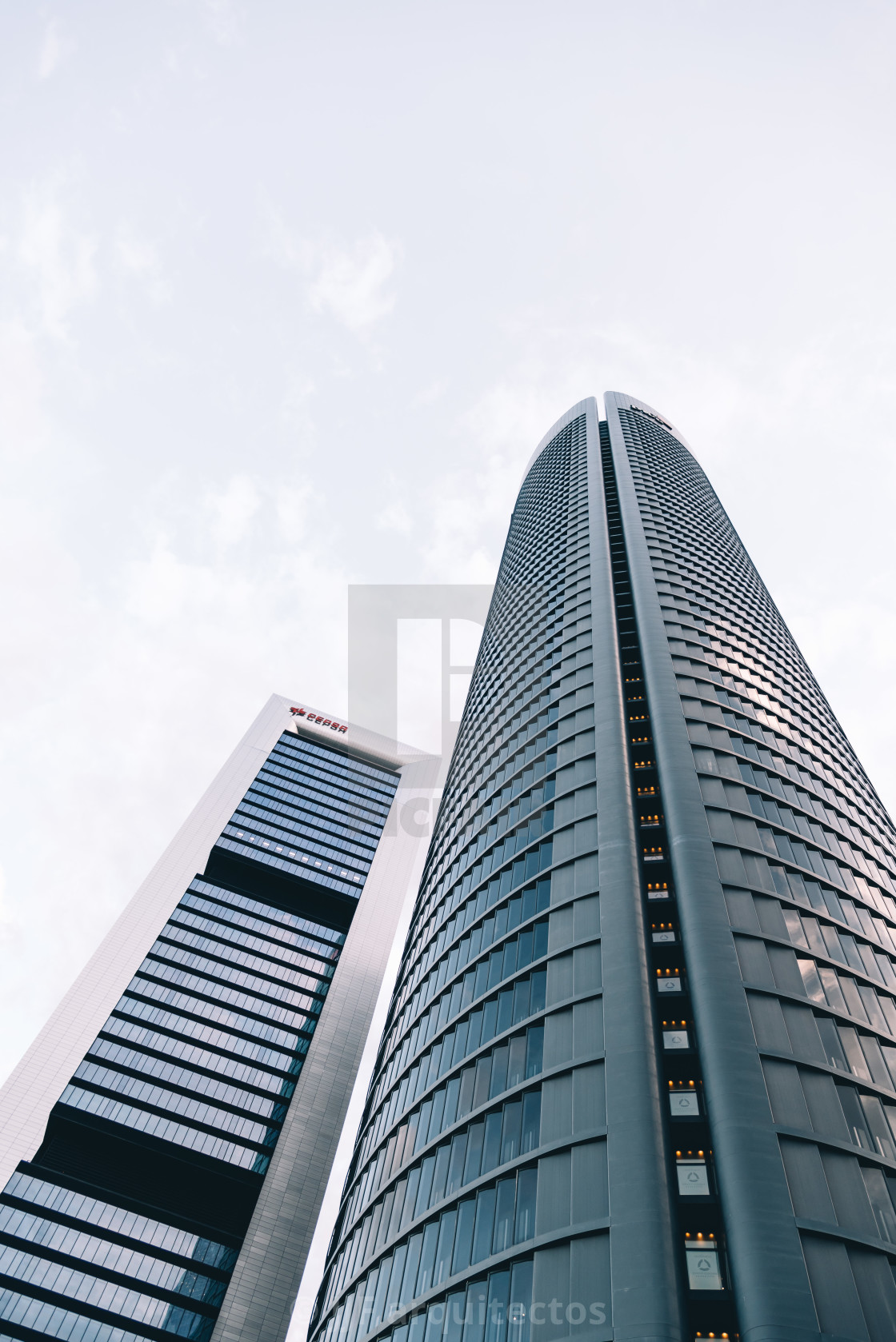 "Low angle view of skyscraper in business district against sky" stock image