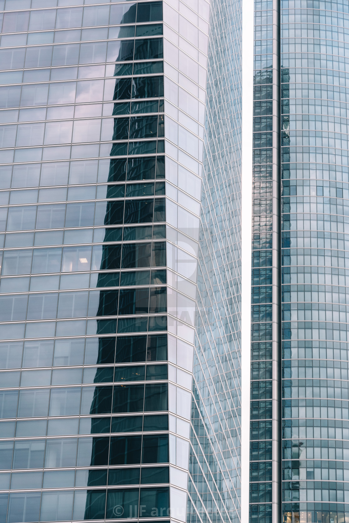 "Low angle view of skyscrapers in business district against sky" stock image