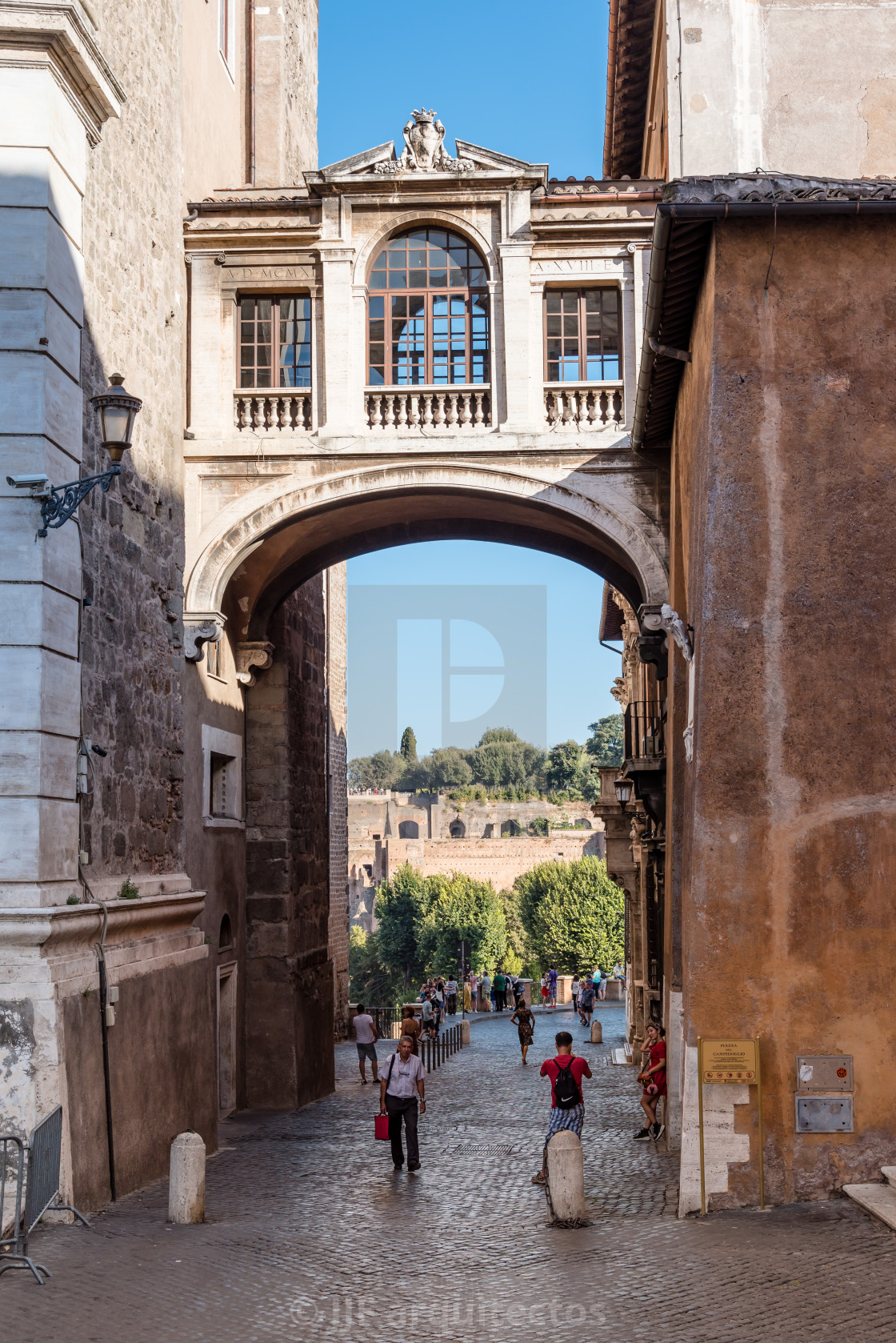 "View of Forum of Rome framed by an arch in Square of Campidoglio" stock image