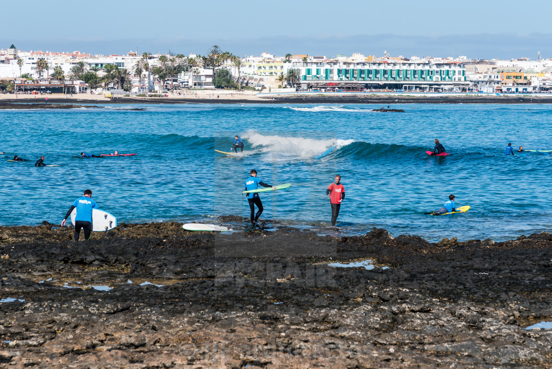 "Surfers in the beach of Corralejo Bay" stock image