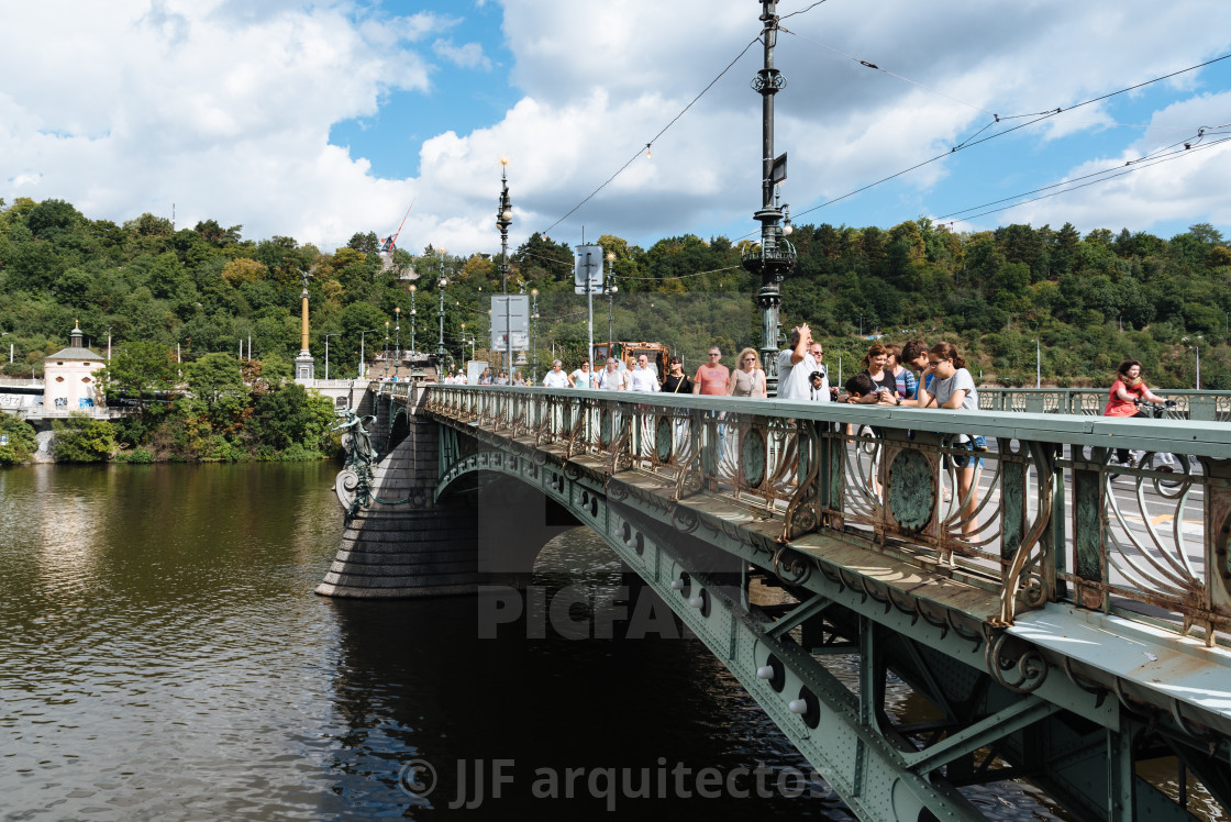 "People crossing bridge in Prague" stock image
