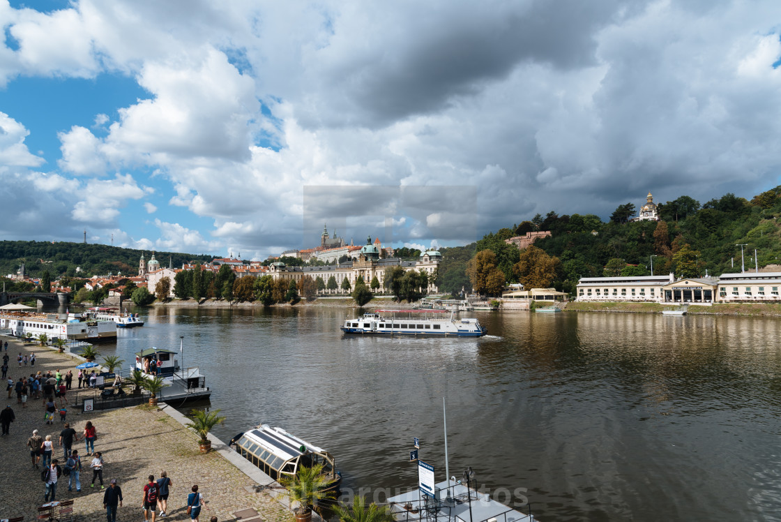 "Touristic boats in Prague against cityscape" stock image