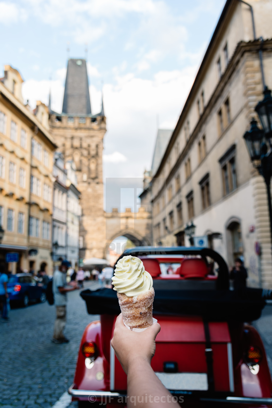 "Young holding trolo ice cream against cityscape of Prague" stock image