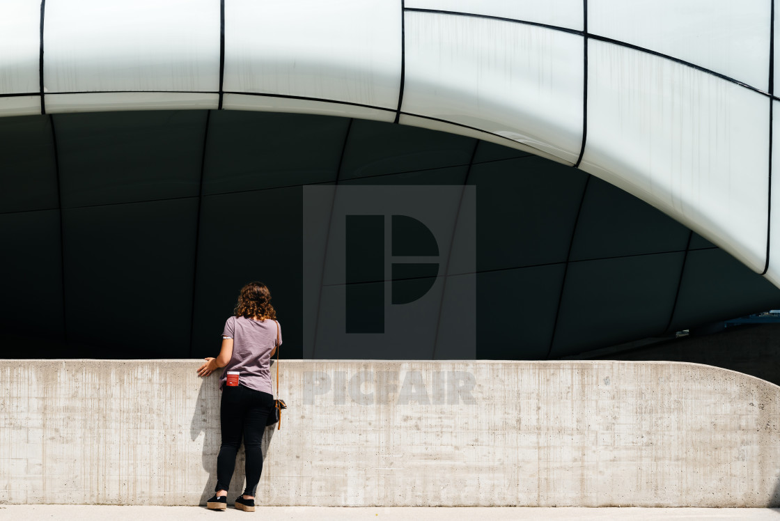 "Full length woman wearing casual against modern architecture bui" stock image