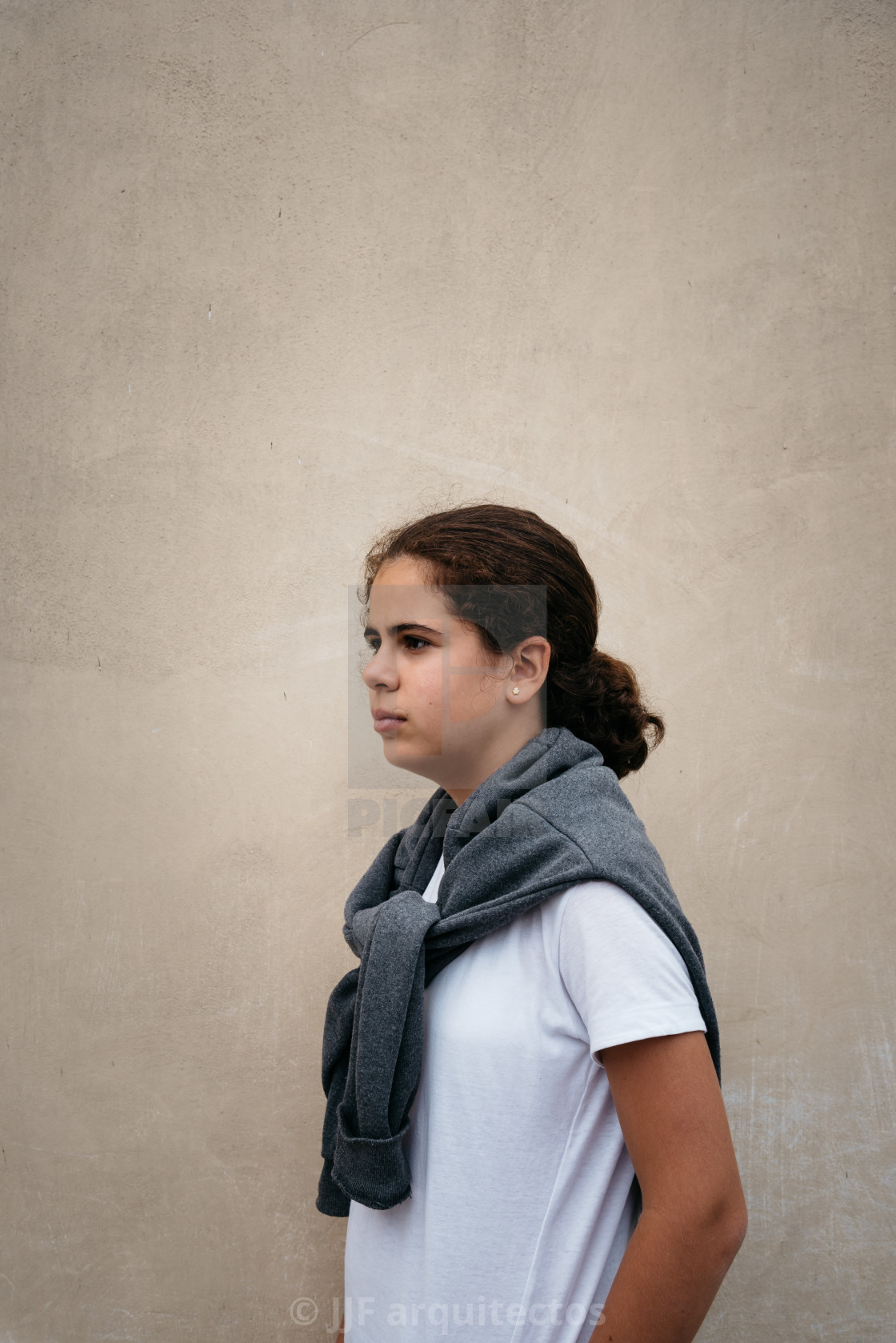 "Beautiful girl against wall" stock image