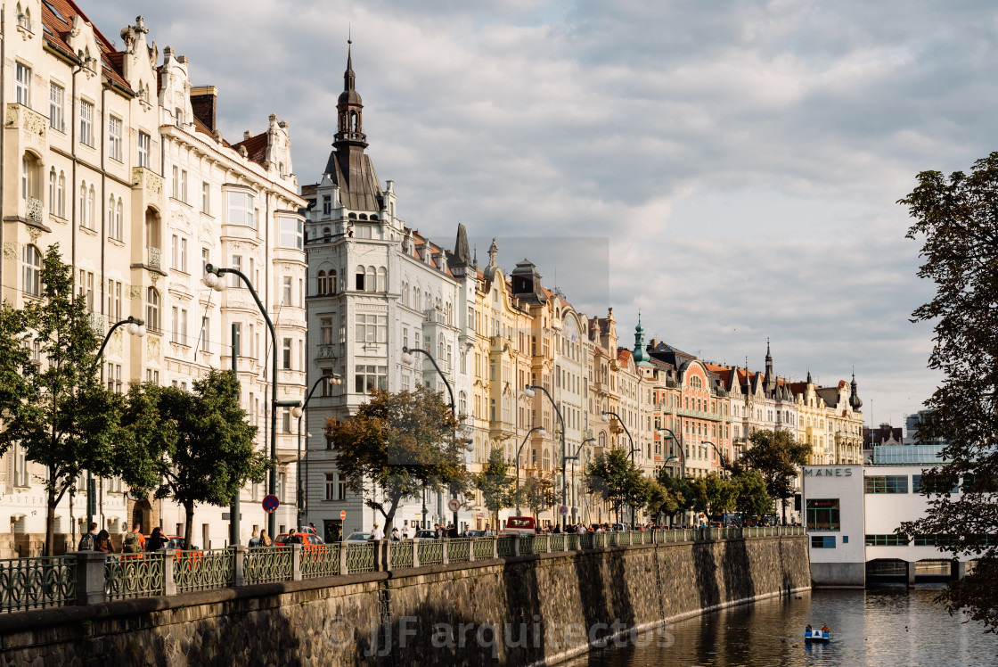 "Residential buildings on riverside of Vltava River in Prague" stock image