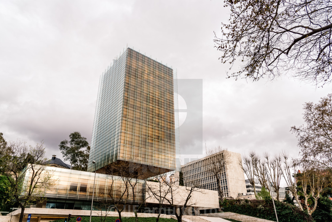 "Low angle view of skyscraper against cloudy sky" stock image