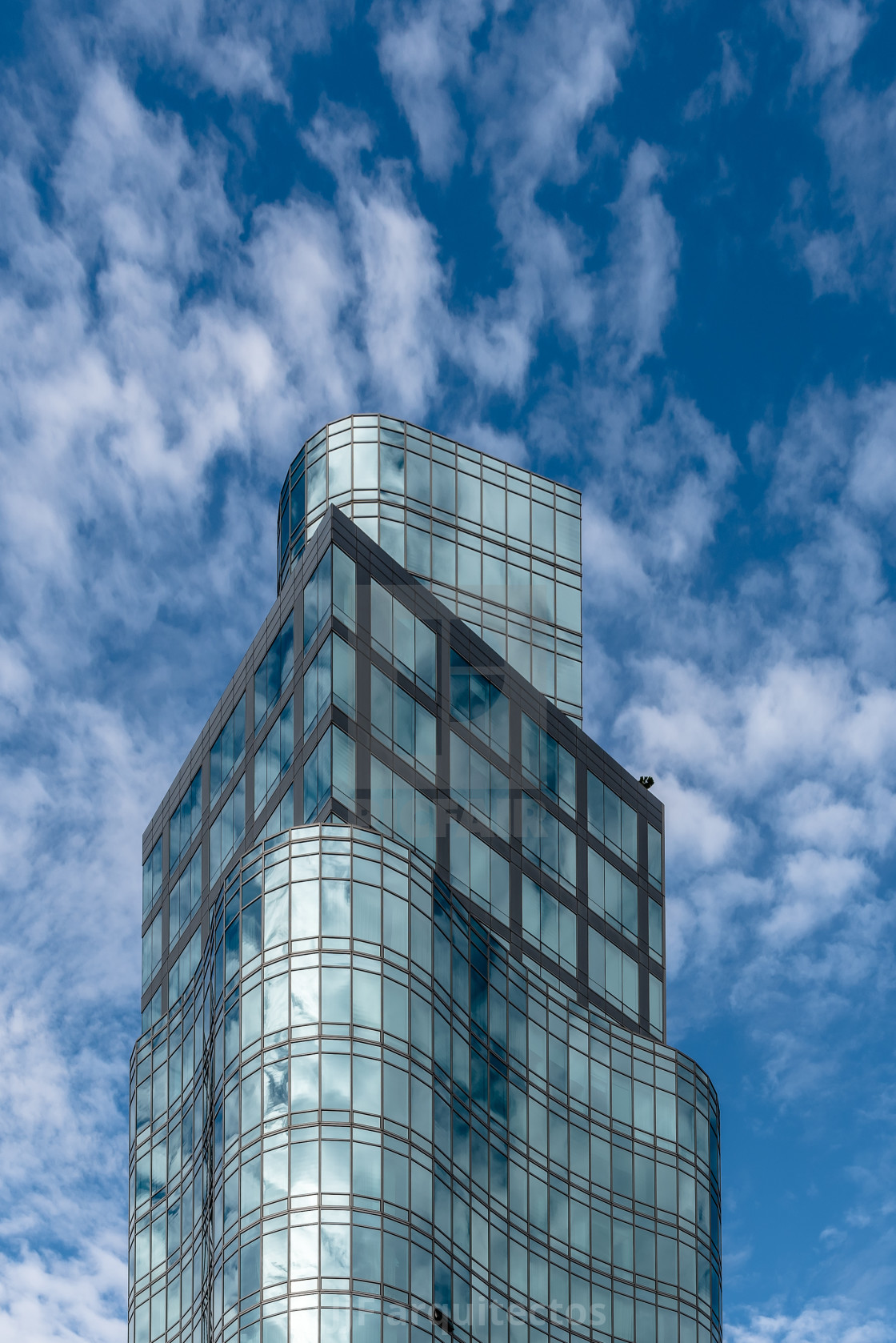 "Reflections of clouds against modern skyscraper in New York" stock image