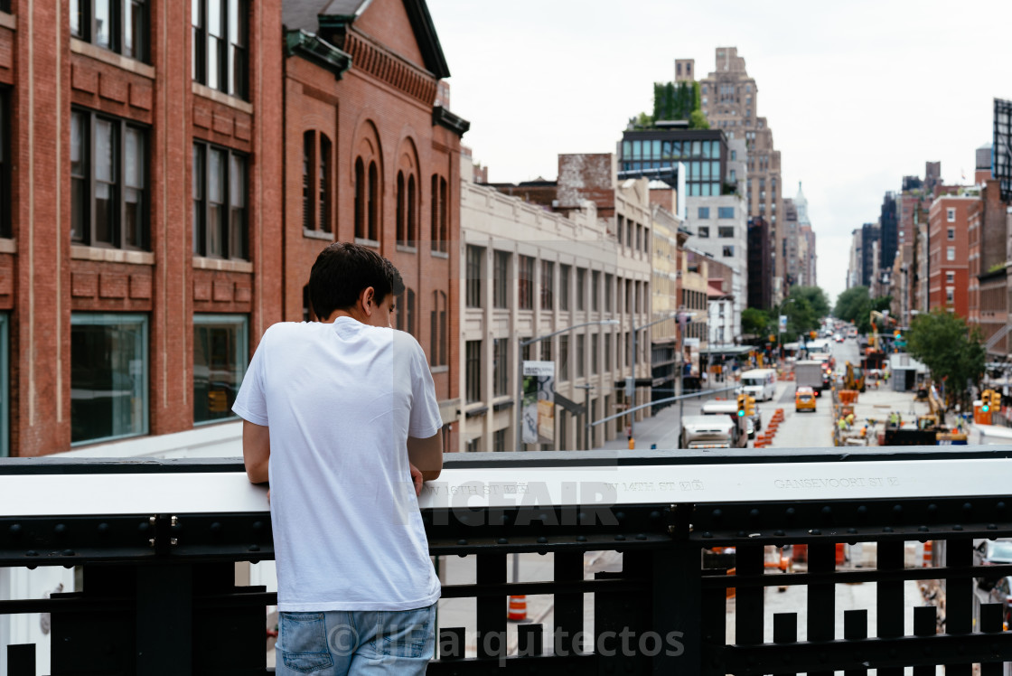 "Young man looking at New York cityscape" stock image