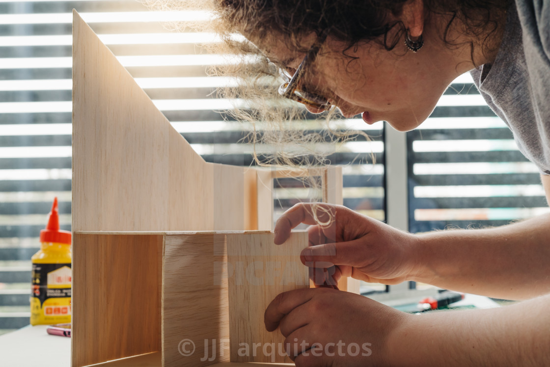 "A Woman architecture student working on models" stock image