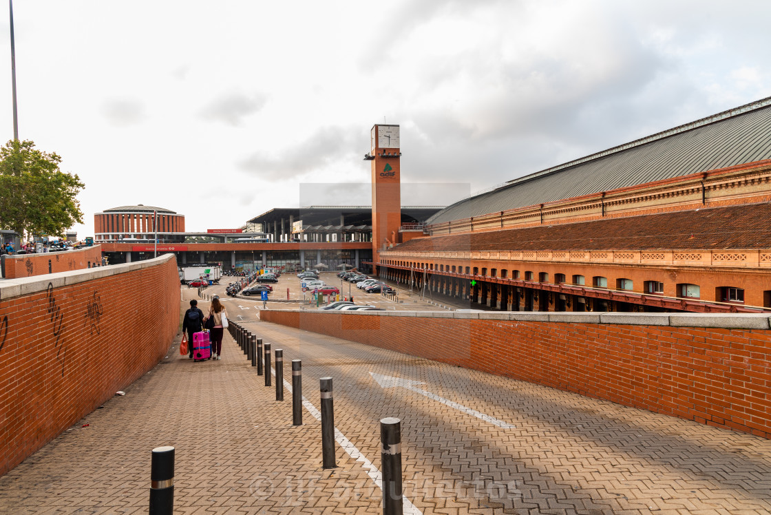 "Tourists with luggage enter Atocha Railway Station in Madrid" stock image