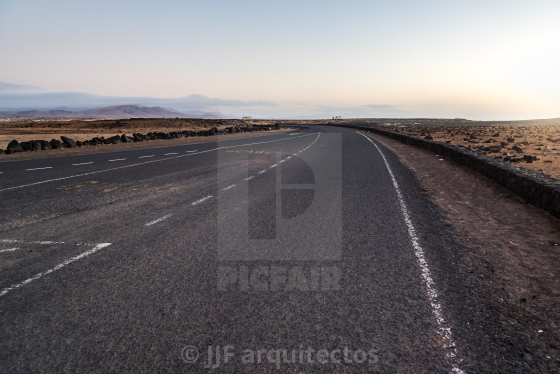 "Desertic road in Fuerteventura at sunset, Spain" stock image