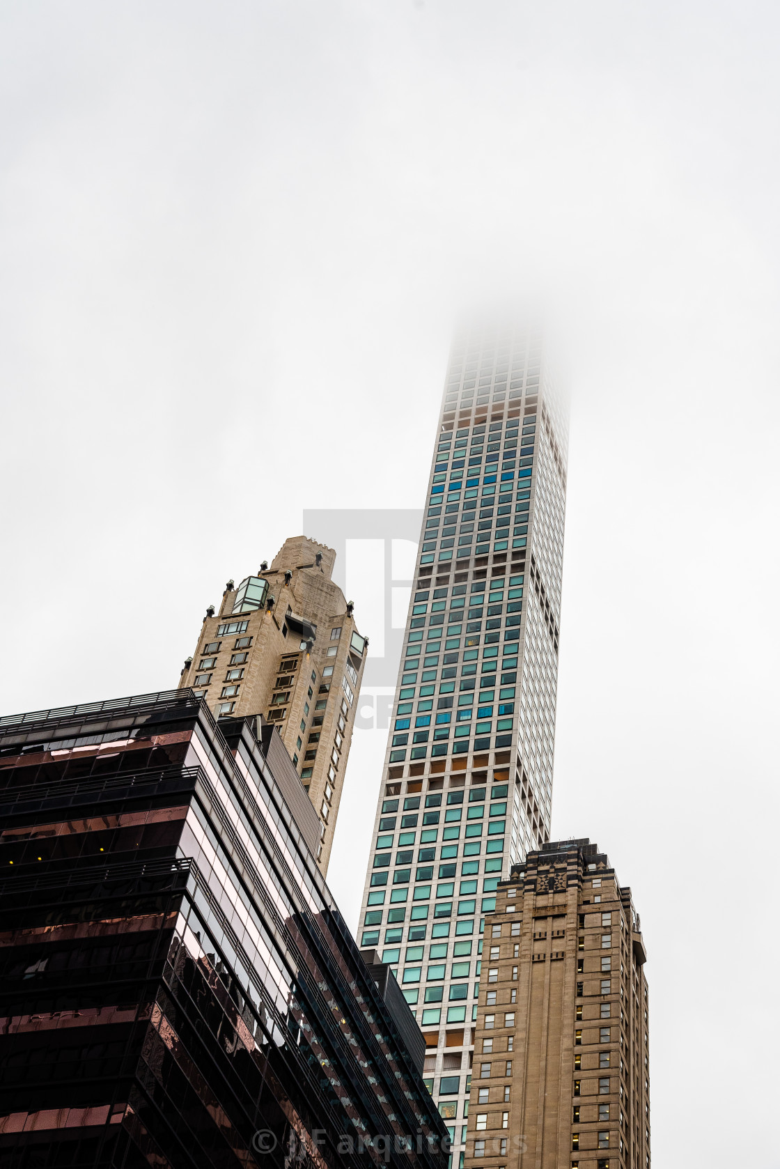 "Low angle view of skyscrapers a misty day" stock image