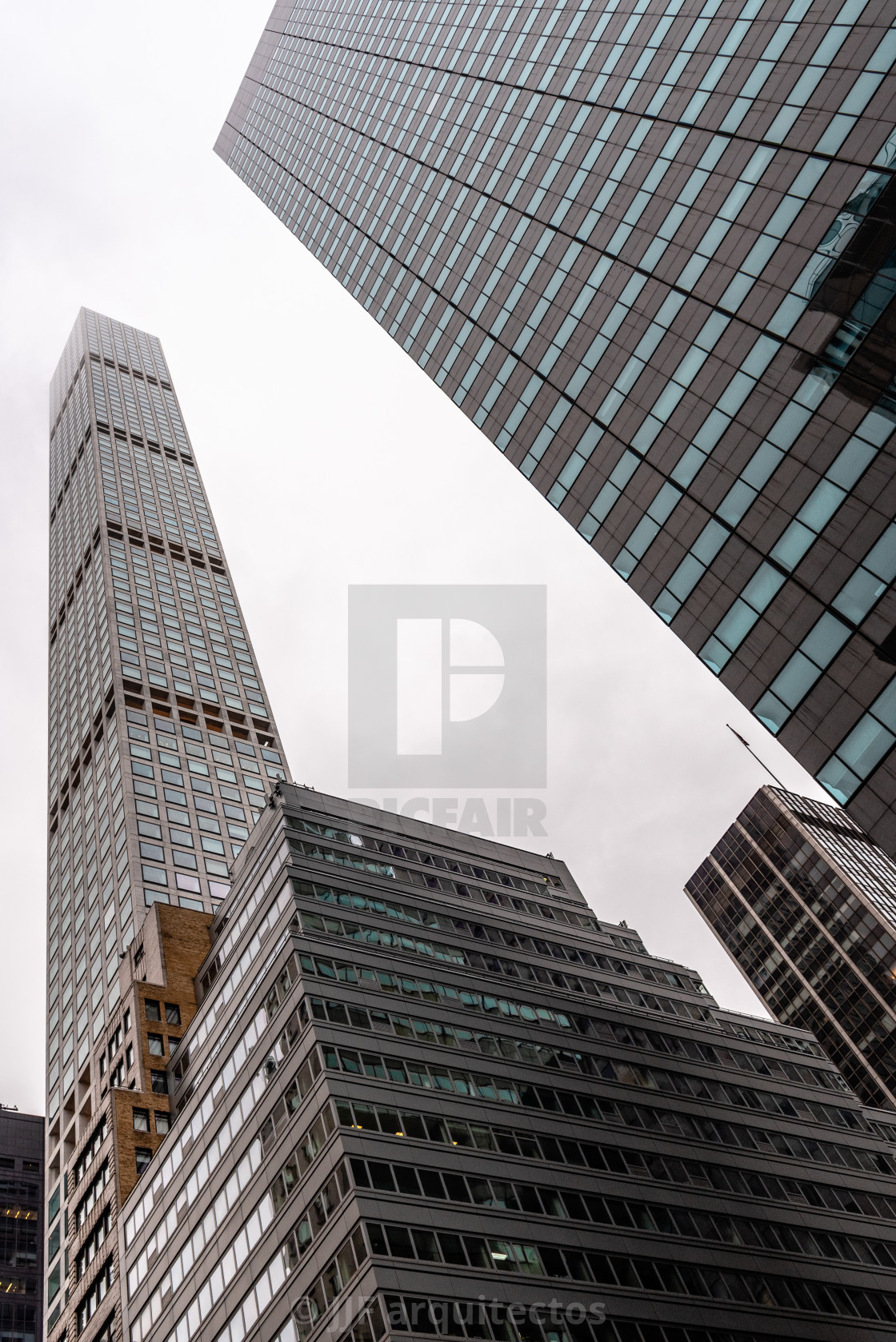 "Low angle view of skyscrapers a misty day" stock image