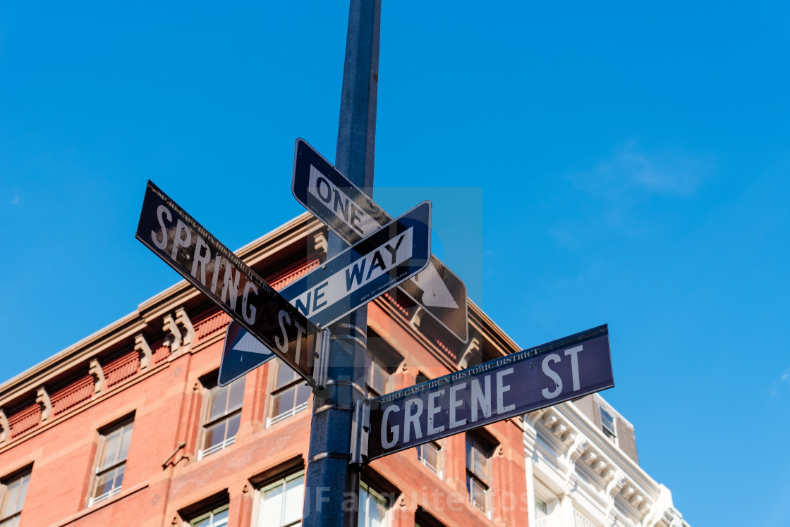 "Typical building and street name sign in New York" stock image