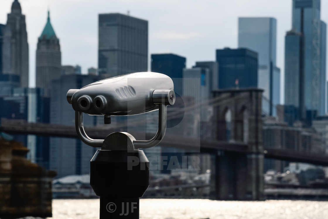 "City binoculars against Brooklyn Bridge in NYC" stock image