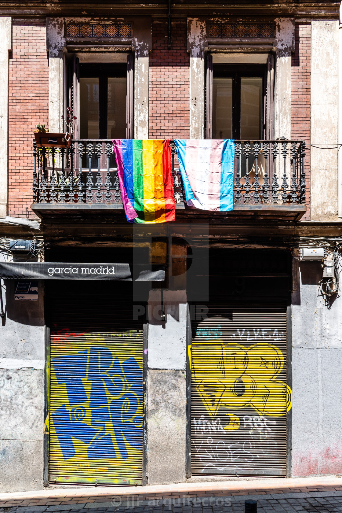 "Cityscape with gay rainbow flags on balconies in Madrid" stock image