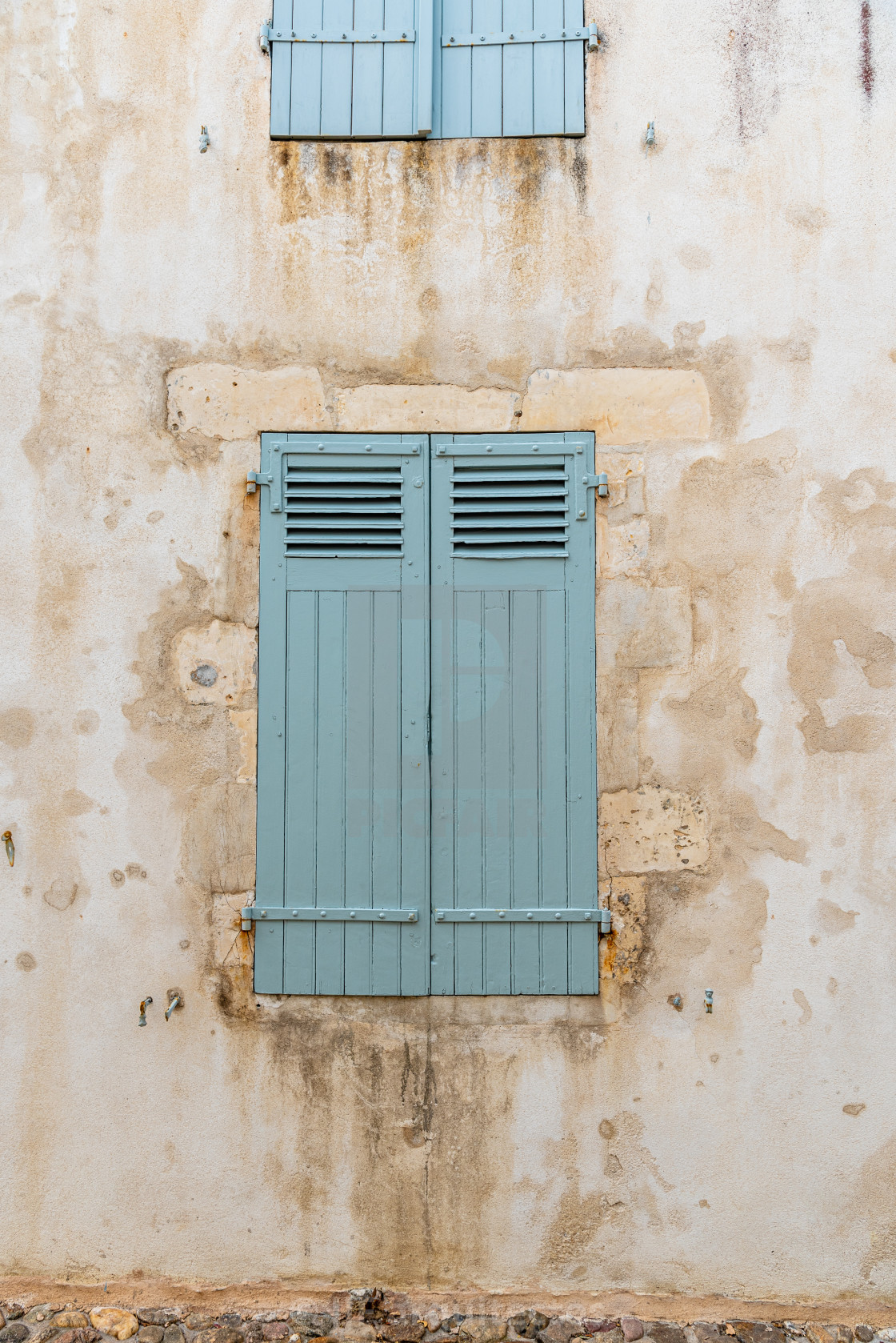 "Old window with wooden light green painted shutters" stock image