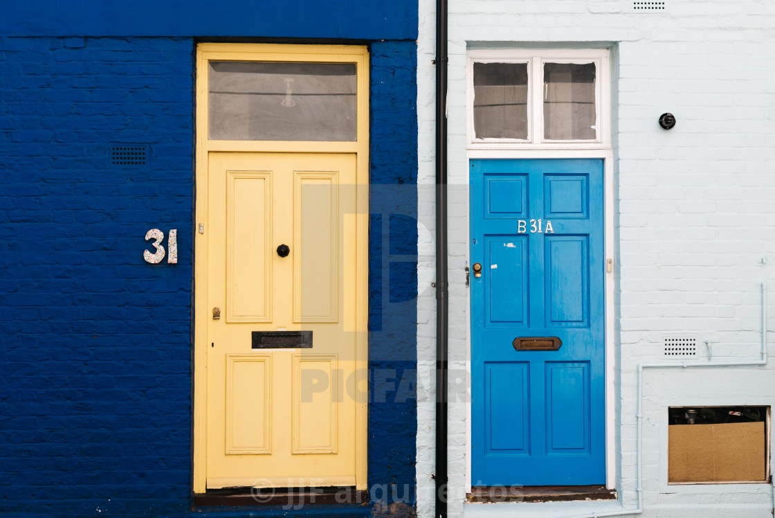 "Colorful house doors in St lukes mews alley in London" stock image