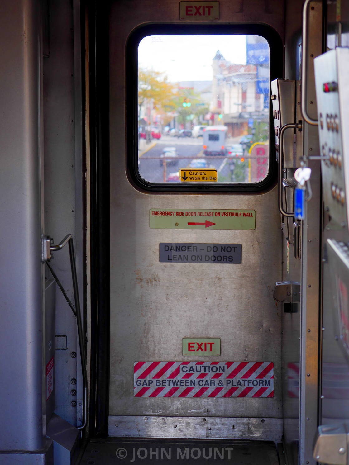 "Through the train window to the street" by JOHN MOUNT - $25.10 "Through the train window to the street" stock image